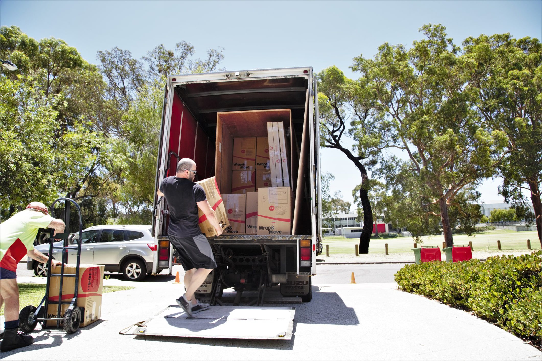 What To Do When Moving House | MD Movers packing up moving van with boxes