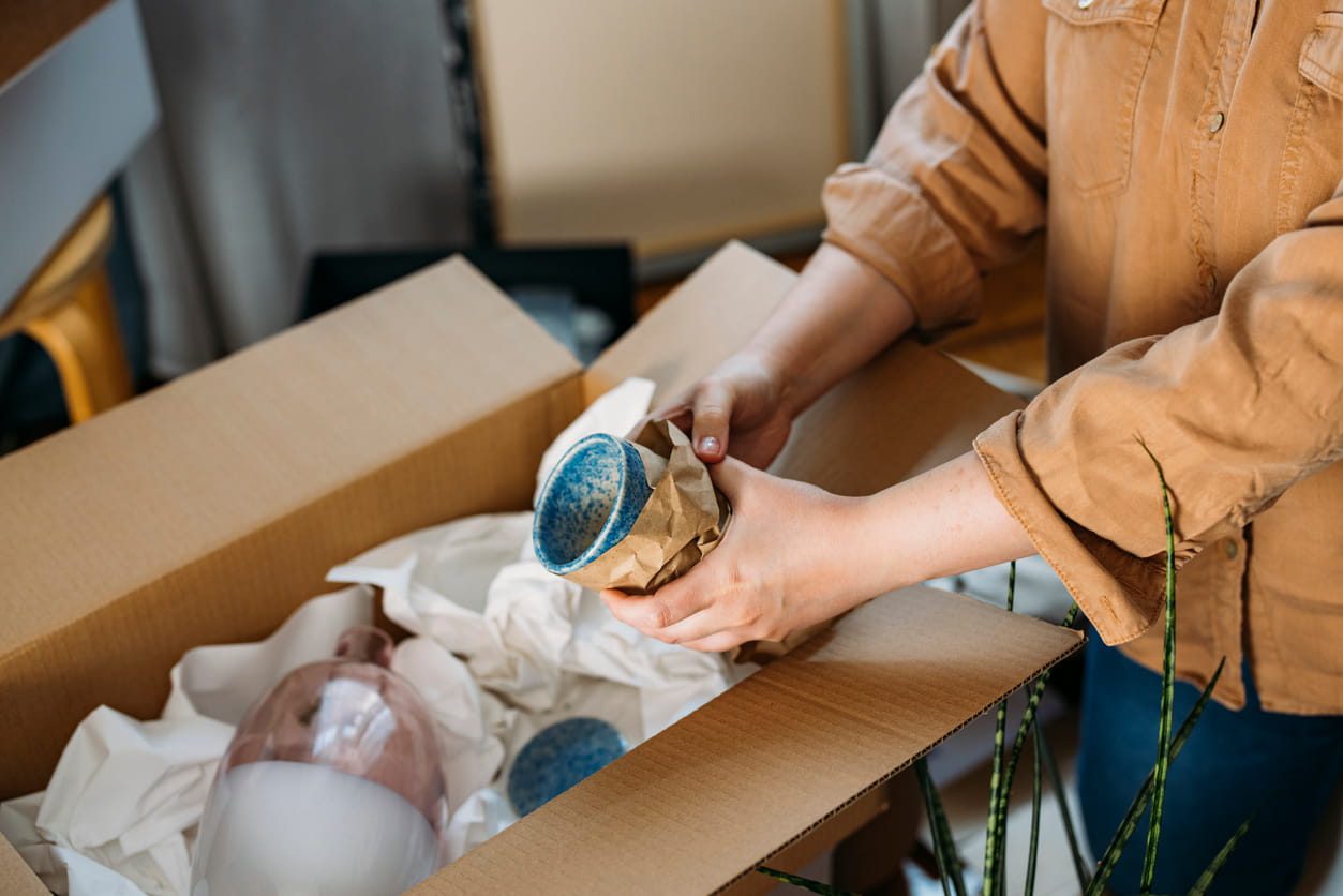 How Do You Pack Fragile Items When Moving House? | MD Movers packing away fragile items for move